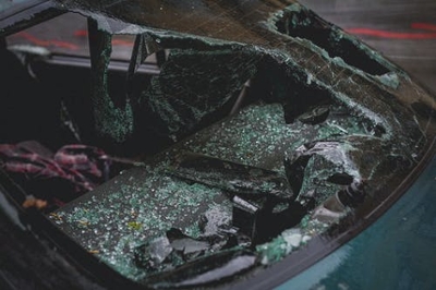 A wrecked car with shattered windshield