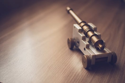 A miniature prototype figure of an artillery piece