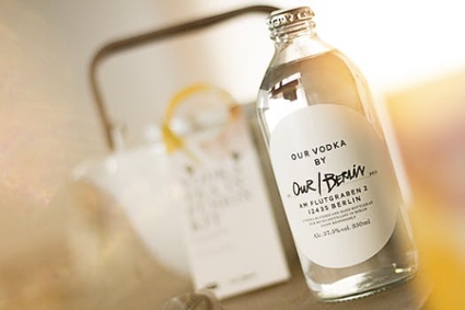 A vodka bottle captured sharply in a blurred background